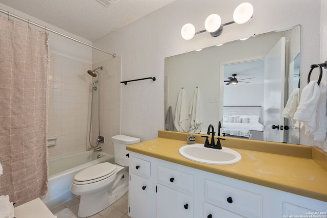 full bathroom featuring ceiling fan, toilet, tile patterned flooring, vanity, and tiled shower / bath combo