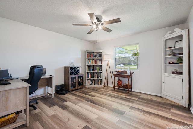 office area featuring a textured ceiling, ceiling fan, and hardwood / wood-style flooring