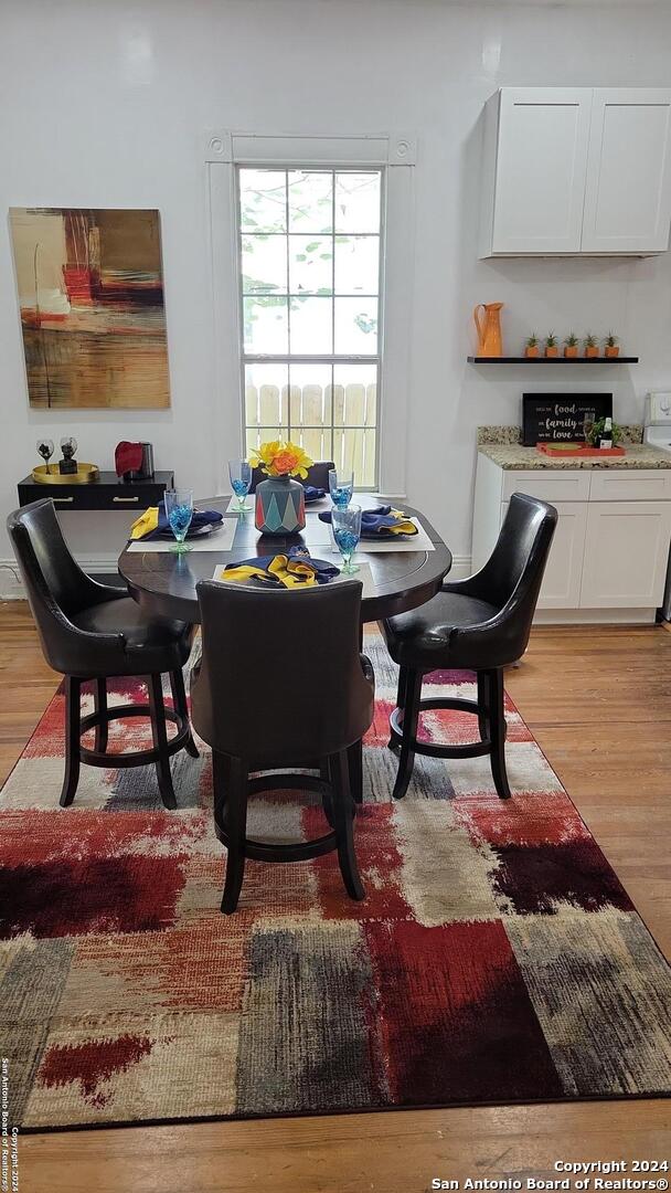 dining space featuring light wood-type flooring