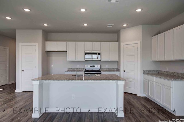 kitchen featuring white cabinetry, an island with sink, and appliances with stainless steel finishes