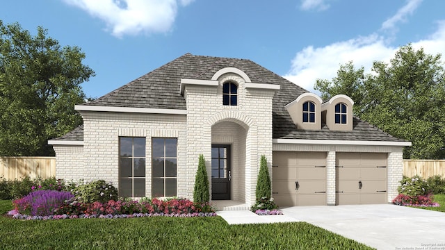 french country home with a garage, fence, concrete driveway, and brick siding