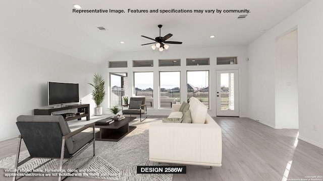 living area featuring visible vents, wood finished floors, a wealth of natural light, and baseboards