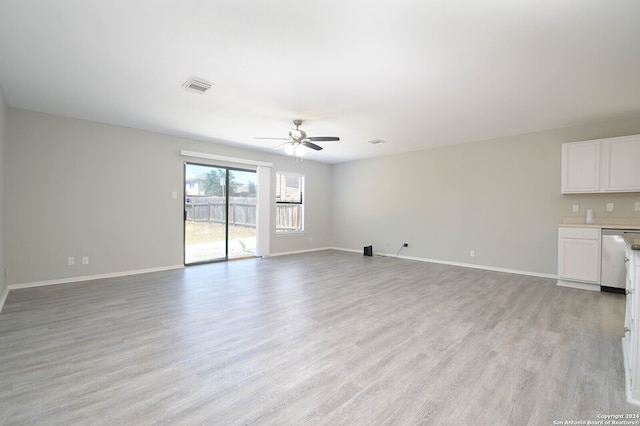 unfurnished living room with light wood-type flooring and ceiling fan