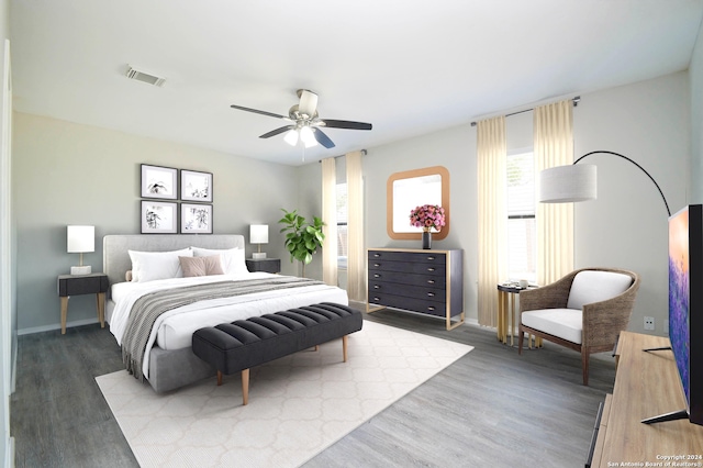 bedroom with ceiling fan and hardwood / wood-style floors