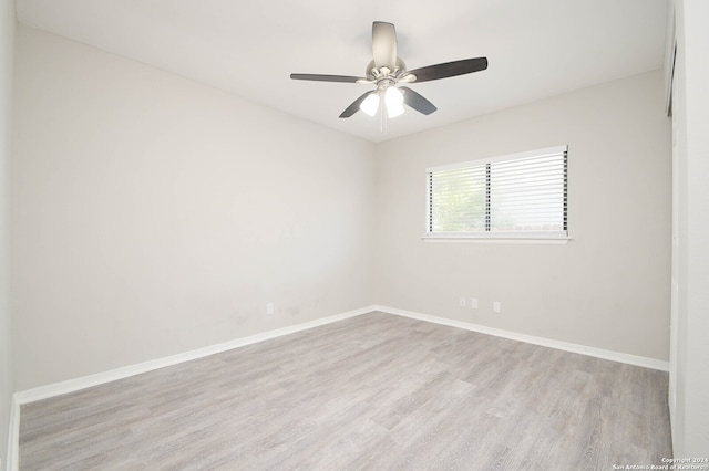 unfurnished room with hardwood / wood-style flooring and ceiling fan