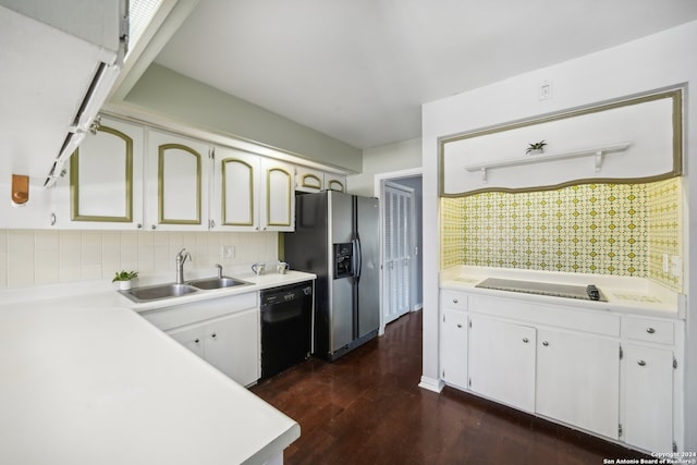 kitchen with sink, dark wood-type flooring, decorative backsplash, white cabinetry, and black appliances