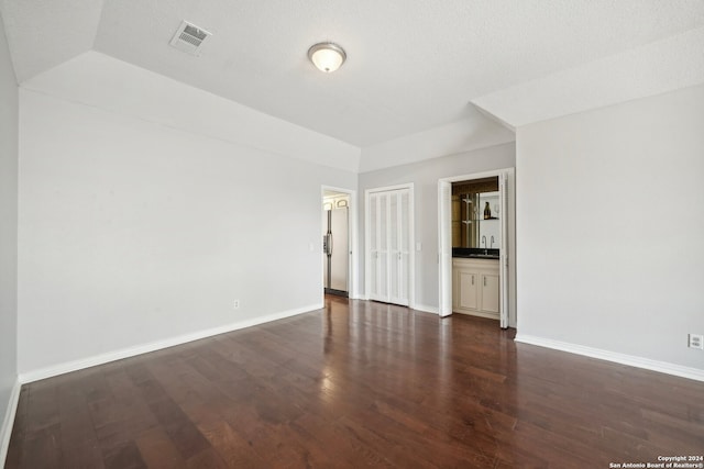 empty room featuring hardwood / wood-style floors and a textured ceiling