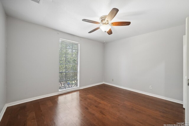 spare room with ceiling fan and hardwood / wood-style flooring