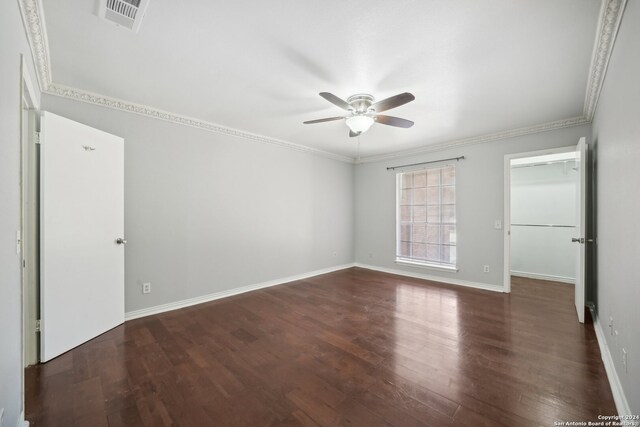 unfurnished bedroom with ceiling fan, ornamental molding, and wood-type flooring