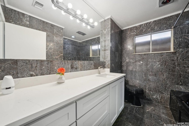 bathroom with toilet, visible vents, tile walls, marble finish floor, and ornamental molding