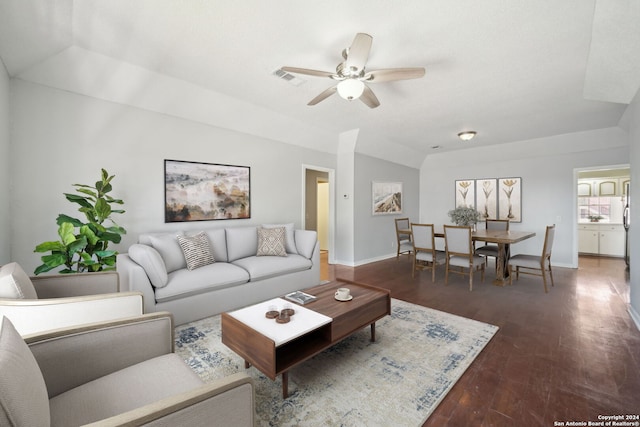 living room featuring ceiling fan, lofted ceiling, and wood-type flooring