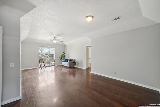 unfurnished living room featuring a textured ceiling, ceiling fan, and hardwood / wood-style floors