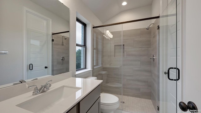 bathroom featuring vanity, toilet, a shower with shower door, and vaulted ceiling