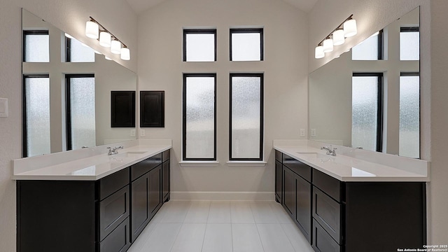 bathroom featuring vanity, tile patterned floors, and a healthy amount of sunlight