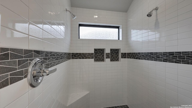 bathroom with tiled shower