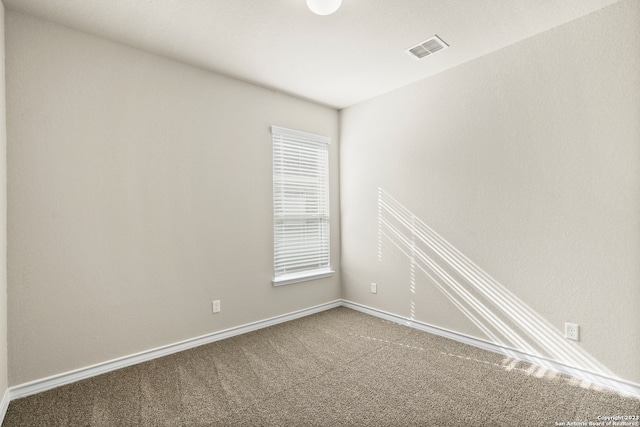 unfurnished room featuring carpet floors