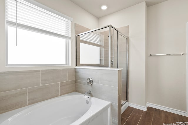 bathroom with shower with separate bathtub