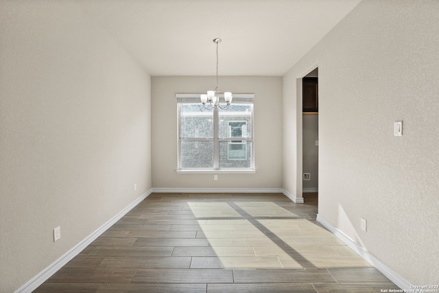 unfurnished dining area with an inviting chandelier