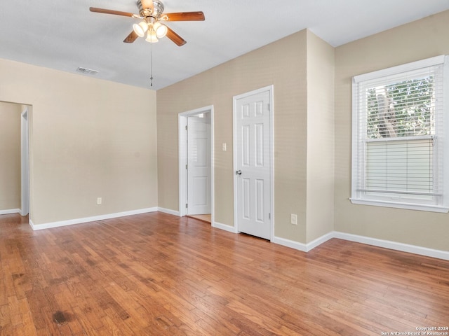 unfurnished bedroom featuring ceiling fan and light wood-type flooring