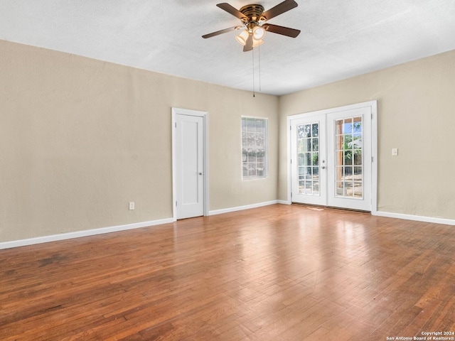 spare room with ceiling fan and hardwood / wood-style floors