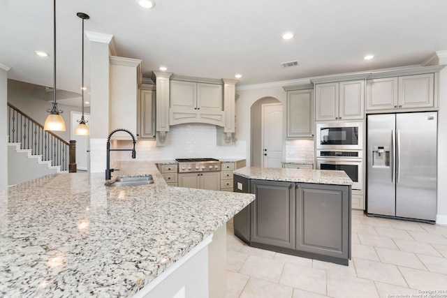 kitchen featuring gray cabinetry, sink, and stainless steel appliances