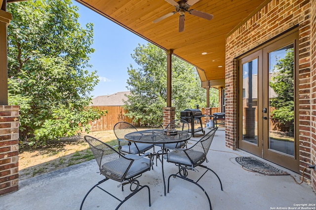 view of patio / terrace with grilling area, ceiling fan, and french doors