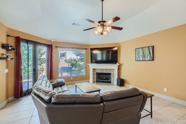 tiled living room featuring vaulted ceiling and ceiling fan