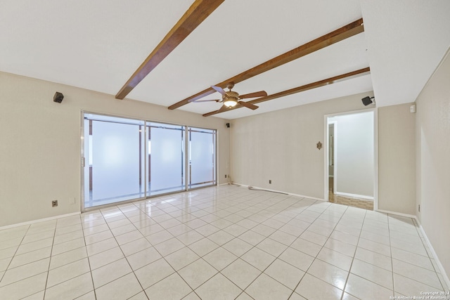 tiled spare room with beam ceiling and ceiling fan