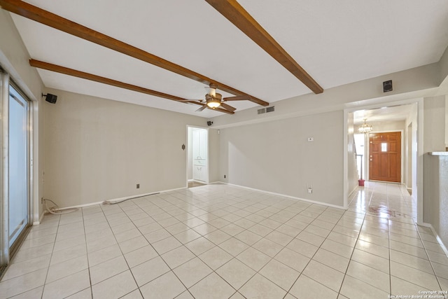 unfurnished room with beamed ceiling, ceiling fan with notable chandelier, and light tile patterned flooring