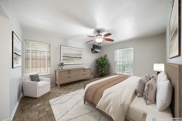 bedroom with parquet flooring and ceiling fan