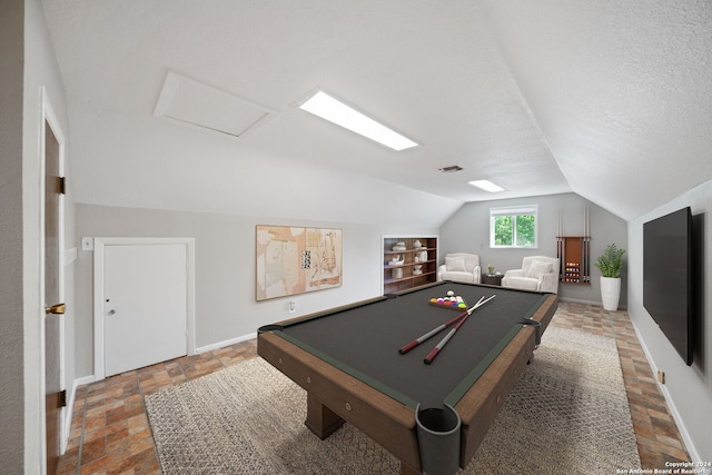 playroom featuring built in shelves, lofted ceiling, a textured ceiling, and billiards