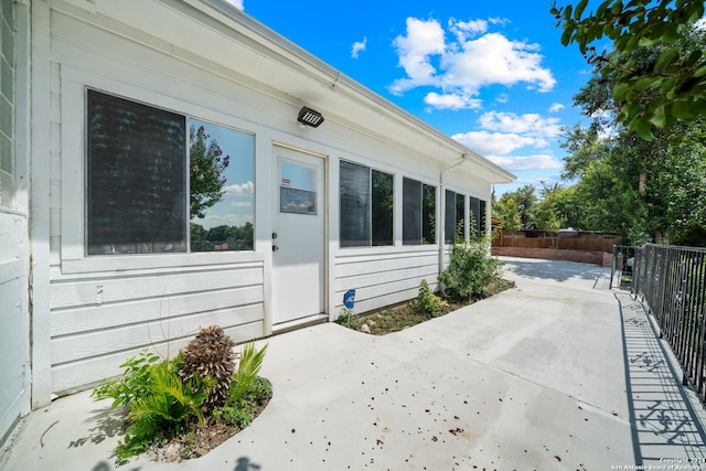 entrance to property featuring a patio area