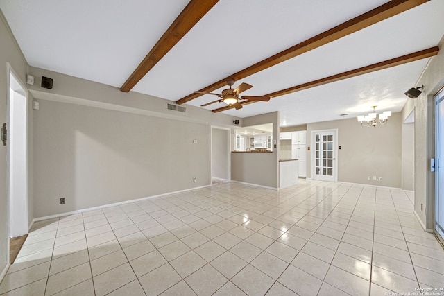 unfurnished living room with ceiling fan with notable chandelier, beamed ceiling, and light tile patterned floors