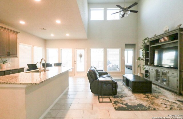 living room featuring vaulted ceiling and light colored carpet