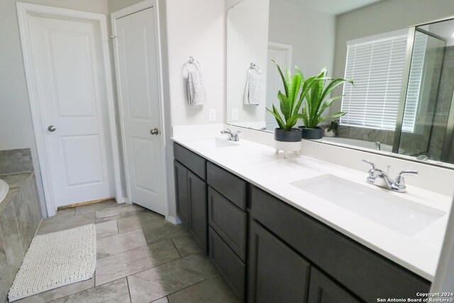 full bathroom with tile patterned floors, vanity, shower / bath combo, and toilet