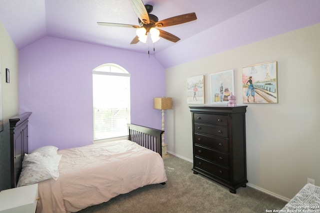 bedroom with ceiling fan, vaulted ceiling, and carpet