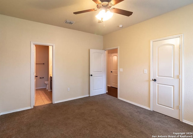 unfurnished bedroom featuring ceiling fan, carpet flooring, and ensuite bathroom