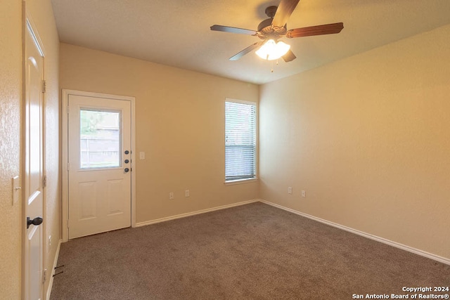 carpeted empty room with ceiling fan