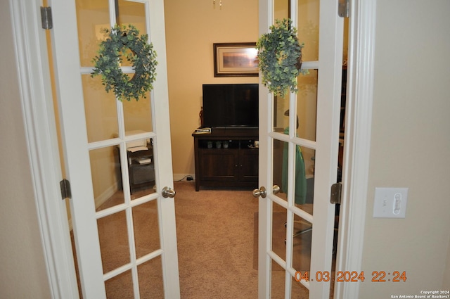 carpeted office space featuring french doors