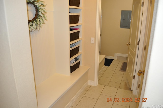 bathroom with tile patterned flooring, electric panel, and baseboards