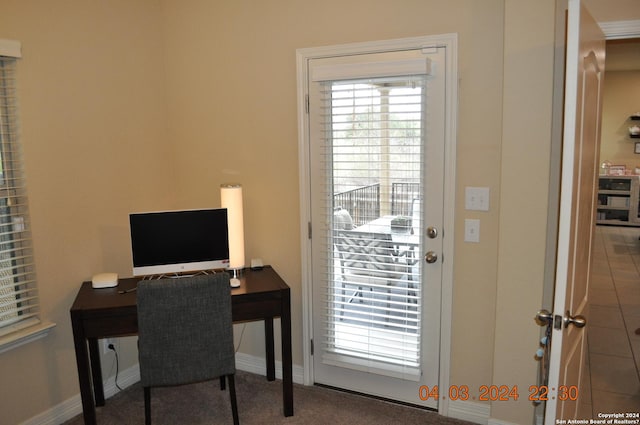 office featuring a healthy amount of sunlight and baseboards