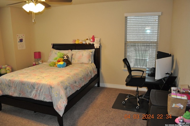 bedroom with carpet and baseboards