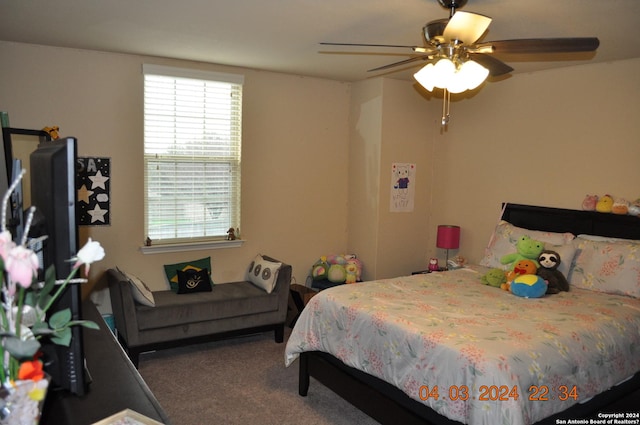 carpeted bedroom featuring ceiling fan