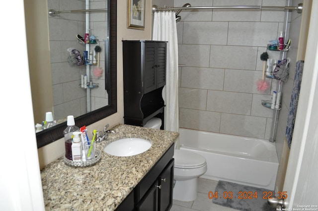 bathroom featuring shower / bath combo, vanity, toilet, and tile patterned floors