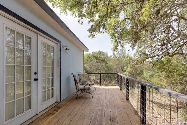 wooden deck featuring french doors