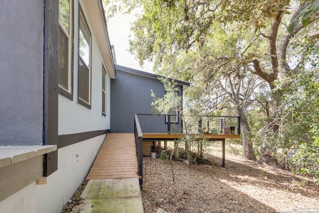 view of yard featuring a wooden deck