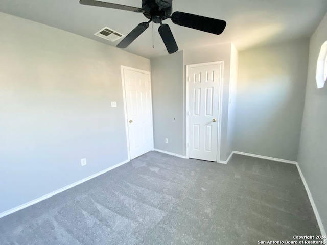 unfurnished bedroom featuring ceiling fan and carpet floors