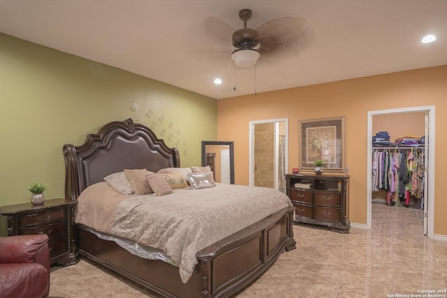 bedroom featuring ceiling fan, a spacious closet, a closet, light tile patterned floors, and connected bathroom