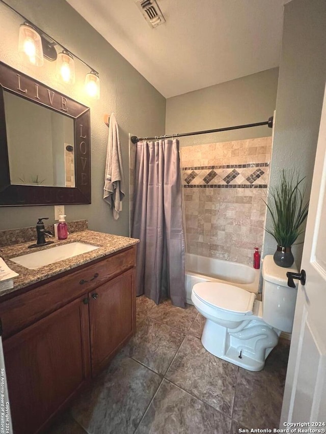 bathroom with shower / bath combo, visible vents, vanity, and toilet