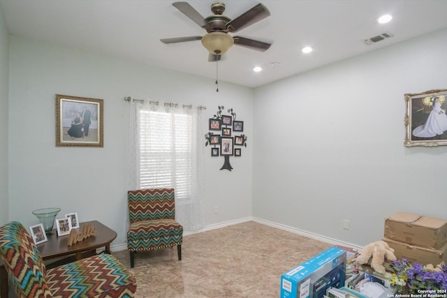 living area with recessed lighting, visible vents, ceiling fan, and baseboards